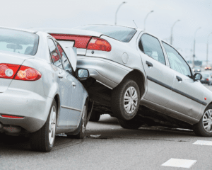damaged cars on a street after a car accident